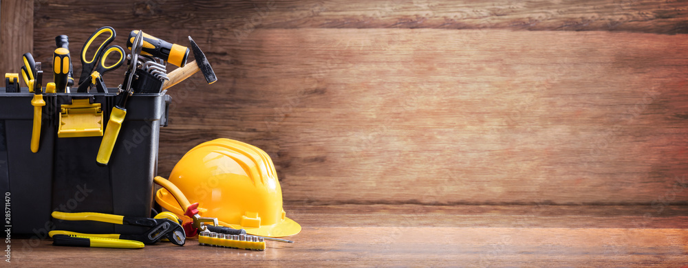 Sticker safety helmet with tools in the black container