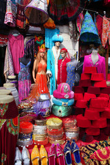 Traditional slippers, fez and caftan on display at a touristic street market in Istanbul