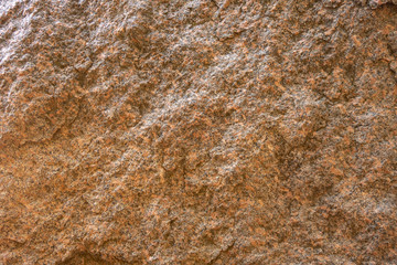 The structure of red and black granite. The texture of natural stone. Creative vintage background.