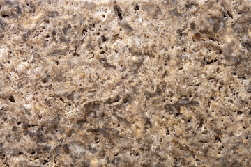 The structure of natural stone. Sand stone. Creative vintage background. Brown natural workpiece.