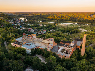 Obraz premium Ruined overgrown abandoned sugar factory in Ramon, aerial view