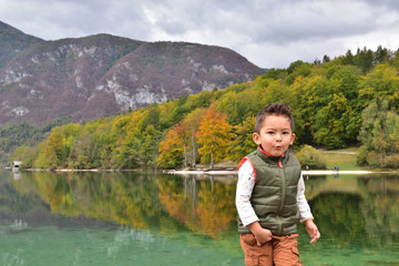 Fototapeta na wymiar Cute boy traveling in Slovenia in the fall