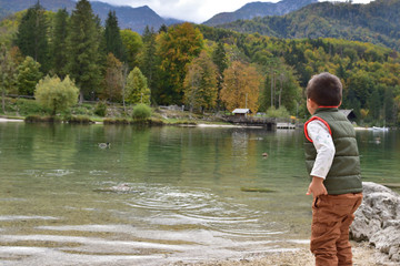 Fototapeta na wymiar Cute boy traveling in Slovenia in the fall