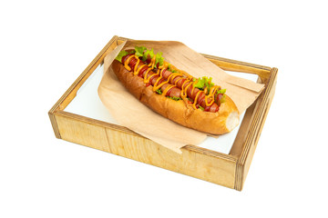 Hot dog with salad and cucumbers with tomato ketchup and mustard on white background. Tasty and beautiful fast food on a light back.