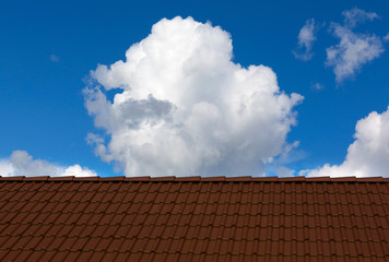 Tiles roof and sky on sunny day.