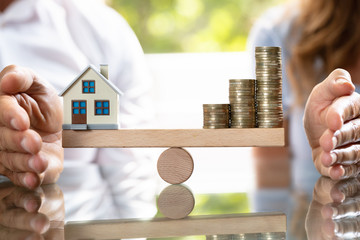 Balancing Of Stacked Coins And House Model On Seesaw