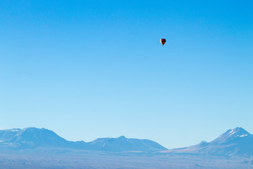 Hot air balloon over Chileand Andes