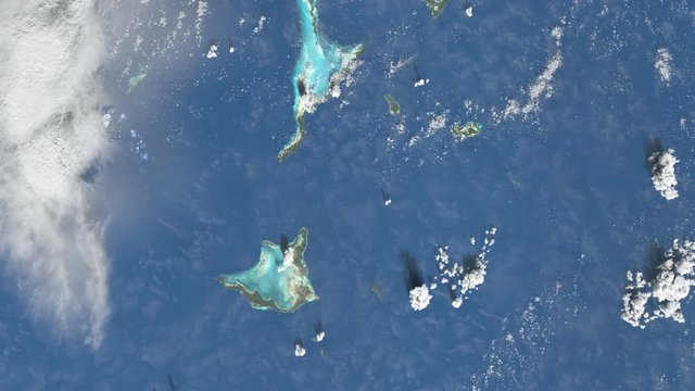 Slow long flight above Bahama islands in space. Beautiful view over the famous destination with green islands, blue turquoise water and white beaches. Sat Img by NASA.