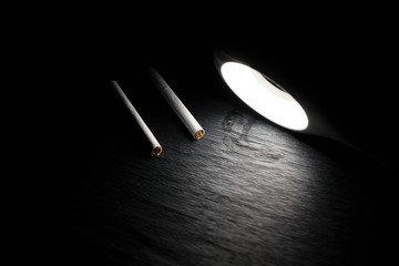 Two cigarettes under the lamp