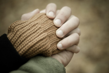 The guy holds the girl by the hand