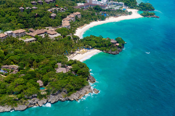 Fototapeta na wymiar Aerial view from the drone on the landscape tropical sand beach with palm trees. Summer vacation consept.