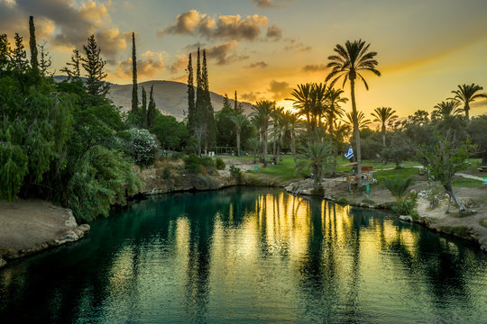 Aerial view of the sunset over Sachne or Gan Hashlosha oasis, with popular waterfall in Northern Israel