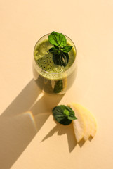 Glass of fresh, green mint and avocado smoothie
