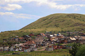 Gypsy village on eastern Slovakia. Natural living. Typical gypsy settlement under the hills.