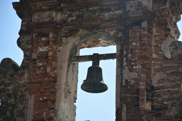 Bell Between Brick Wall