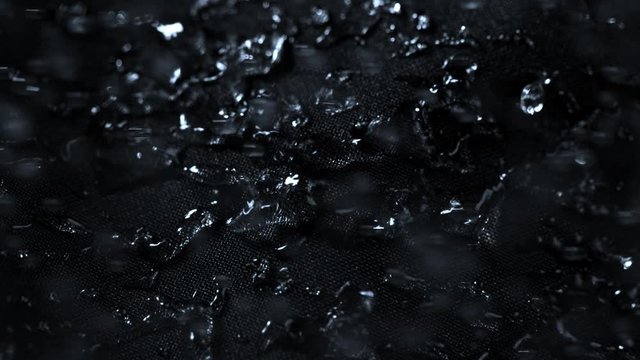 Super Slow Motion Shot of Water Splashing on Waterproof Cloth at 1000fps. Shooted with High Speed Cinema Camera at 4K.