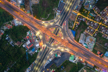 Aerial view of highway junctions Top view of Urban city, Bangkok at night, Thailand.