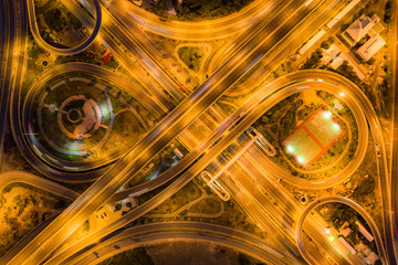 Aerial view of highway junctions Top view of Urban city, Bangkok at night, Thailand.