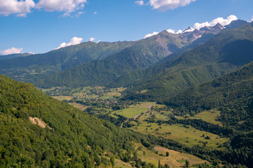 Naklejka na ściany i meble Beautiful view of small village and high mountains in upper Svaneti, Georgia.