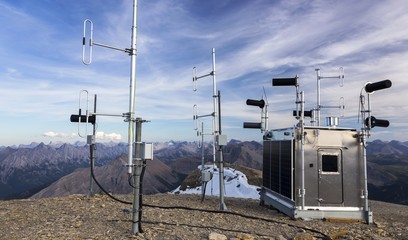 Meteorological Weather Station Building Exterior with Solar Panels and Measurement Instruments on Bourgeau Mountain Peak, Canadian Rockies, Banff National Park