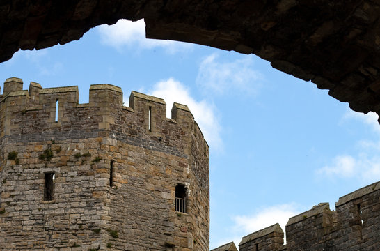 Wales, the old city of Caernarfon. The historic castle. The Well Tower with a view to the Water gate.  Historic and imposing. An English castle in Wales.  