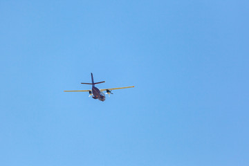 Flying airplane on a blue sky. Flying over Svaneti, Georgia.