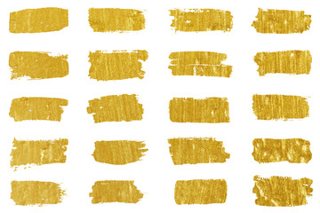 Fototapeta na wymiar Collection of golden paint strokes. Grunge abstract hand painted element gold strokes with a brush.