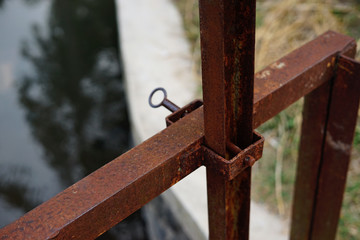 Rusty iron key dam gate control for irrigated rice field