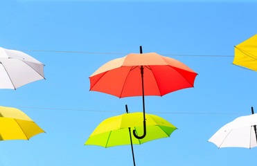 Fototapeta na wymiar Colorful umbrellas against the blue sky