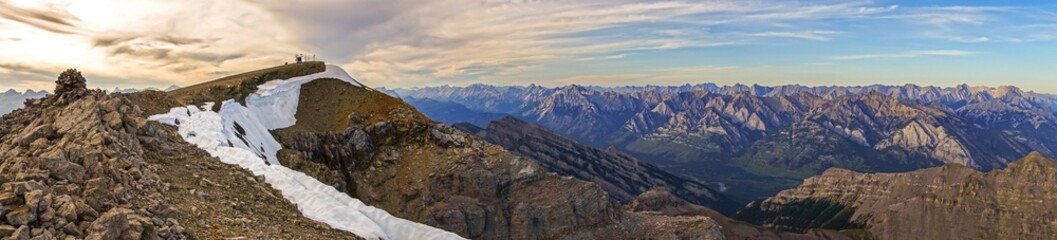 Fototapeta na wymiar Mountain Top Wide Panoramic Landscape View Dramatic Sunset Sky Distant Peaks Banff National Park Alberta Canada