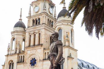 Monument to Simon Bolivar and the Parish Church of the small town of Ventaquemada in Colombia