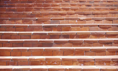 A close sectional full frame view of old red brick stairs