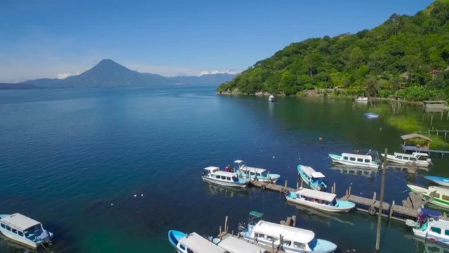 Aerial over Lake Amatitlan in Guatemala reveals the Pacaya Volcano.