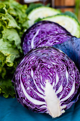 Fresh organic purple cabbage and other vegetables, close up.