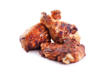 baked chicken legs on a hot grill on a white background,fast fried food,logo chicken thighs isolated
