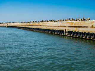 Fototapeta na wymiar Perpective view of the seaport wall