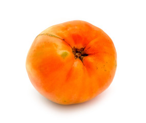 Ripe ugly tomato on a white background.