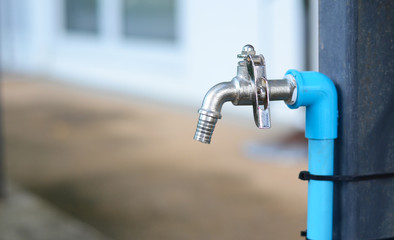 Silver faucet,Blue water pipe Tied to the pole