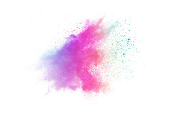Freeze motion of colorful color powder exploding on white background.  Paint Holi.
