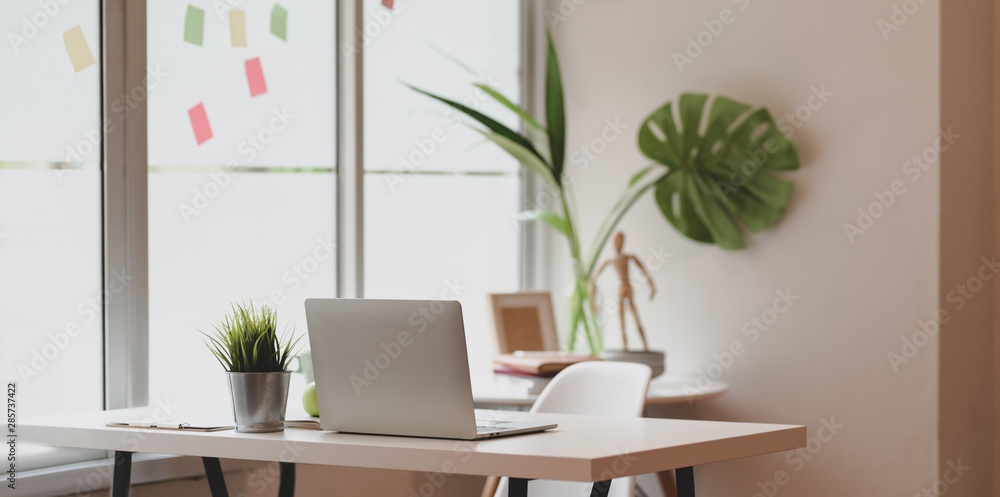 Poster minimal graphic designer workplace with open laptop computer