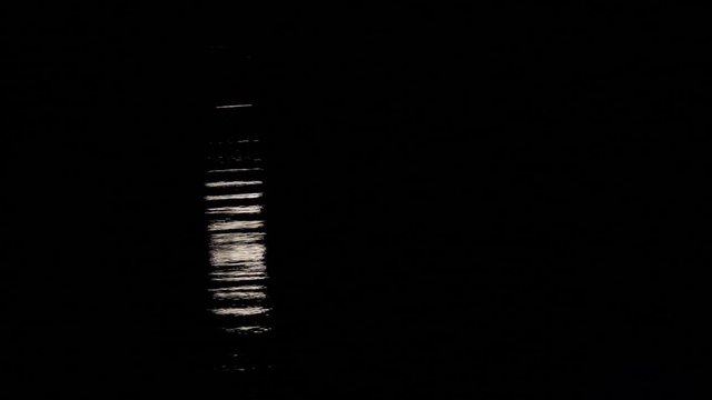 Moon light reflection on calm sea water