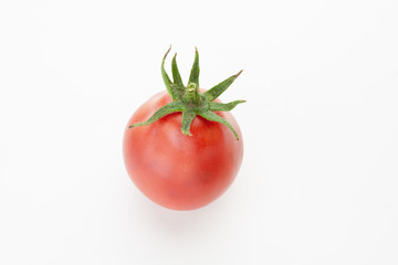 red tomato just from the garden on a white background