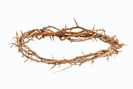 Easter symbolism, the crucifixion and resurrection of the son of god and the passion of Jesus Christ conceptual idea with crown of thorns isolated on white background with clipping path cutout