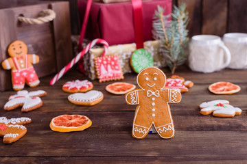 Fototapeta premium Christmas homemade gingerbread cookies on wooden table. It can be used as a background