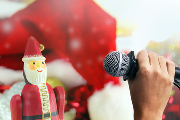 Red Christmas hat and microphone with Santa Claus, Merry Christmas song