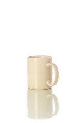 Cute cream color mug with white background. Mug for drinking hot drinks like coffee or tea.