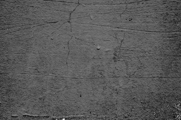 Texture of a concrete wall with cracks and scratches which can be used as a background