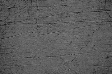 Texture of a concrete wall with cracks and scratches which can be used as a background