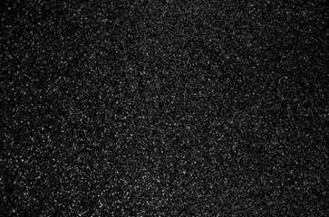 Black sanded texture. Dark simple rough background. Abstract asphalt surface.