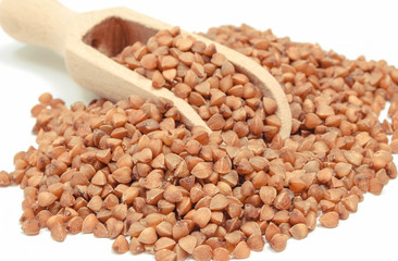 Buckwheat with scoop. Food containing minerals and fiber. White background